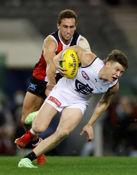 Sam Walsh of the Blues is tackled by Luke Dunstan of the Saints during the 2021 AFL Round 20 match between the St Kilda Saints and the Carlton Blues...
