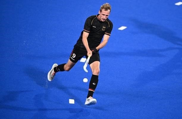 Germany's Niklas Wellen carries the ball during the men's pool B match of the Tokyo 2020 Olympic Games field hockey competition against Netherlands,...