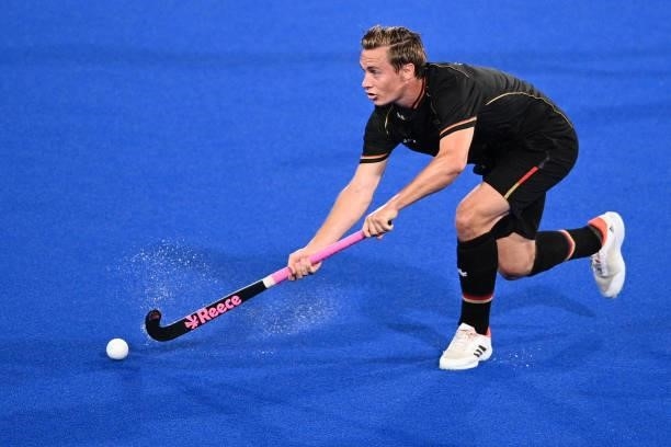 Germany's Mats Jurgen Grambusch strikes the ball during the men's pool B match of the Tokyo 2020 Olympic Games field hockey competition against...
