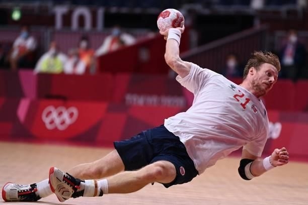 Norway's pivot Magnus Gullerud shoots during the men's preliminary round group A handball match between Germany and Norway of the Tokyo 2020 Olympic...