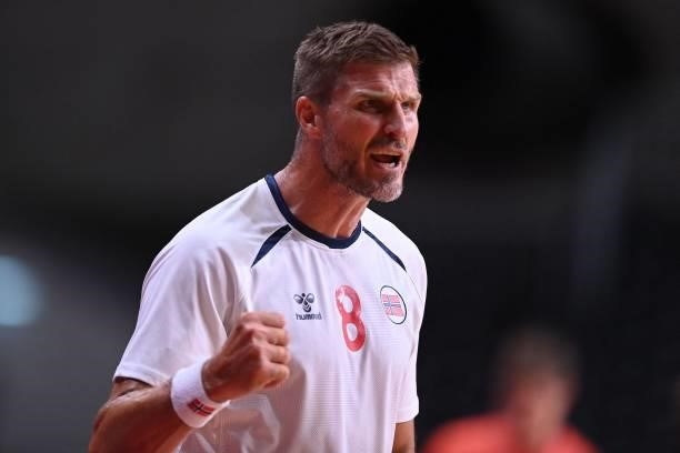 Norway's pivot Bjarthe Myrhol cheer up his teammates during the men's preliminary round group A handball match between Germany and Norway of the...