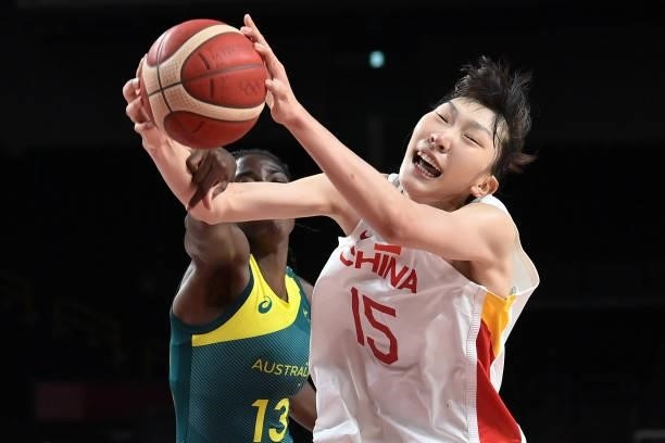 Australia's Ezi Magbegor fights for the ball with China's Han Xu in the women's preliminary round group C basketball match between China and...