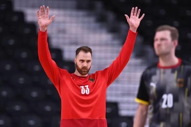 Germany's goalkeeper Andreas Wolff gestures during the men's preliminary round group A handball match between Germany and Norway of the Tokyo 2020...