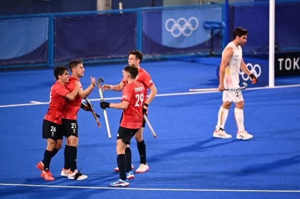 Britain's Liam Paul Ansell celebrates with teammates after scoring against Belgium during their men's pool B match of the Tokyo 2020 Olympic Games...