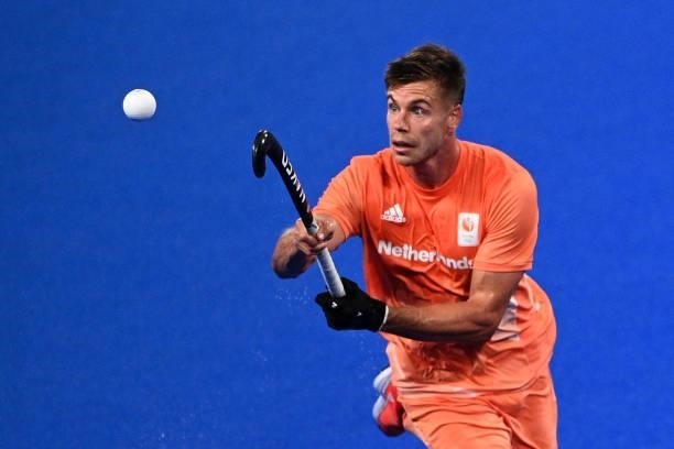 Netherlands' Sander Sebastiaan Robert De Wijn eyes the ball during the men's pool B match of the Tokyo 2020 Olympic Games field hockey competition...