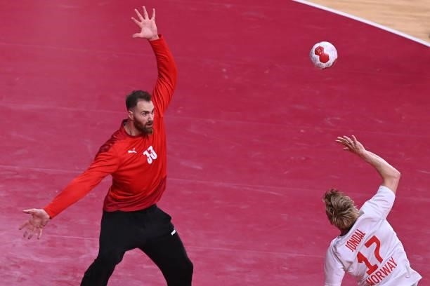 Germany's goalkeeper Andreas Wolff tries tro stop a shot by Norway's left wing Magnus Jondal during the men's preliminary round group A handball...