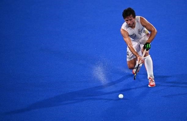 Belgium's Arthur Van Doren strikes the ball during the men's pool B match of the Tokyo 2020 Olympic Games field hockey competition against Britain,...