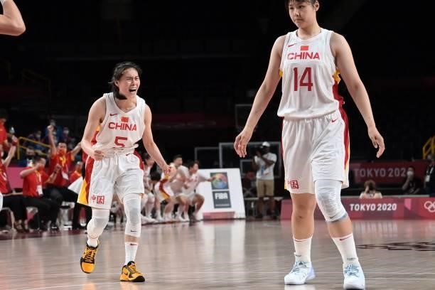 China's Wang Siyu celebrates as her teammate Li Yueru watches after their win in the women's preliminary round group C basketball match between China...