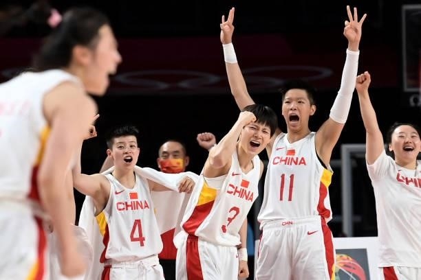 China's players celebrate a point in the women's preliminary round group C basketball match between China and Australia during the Tokyo 2020 Olympic...