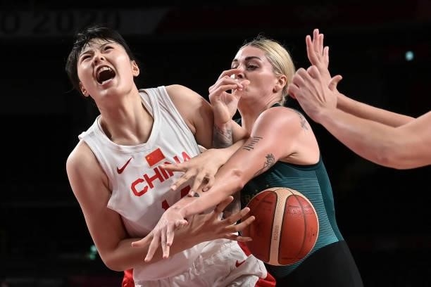 Australia's Cayla George fights for the ball with China's Li Yueru in the women's preliminary round group C basketball match between China and...