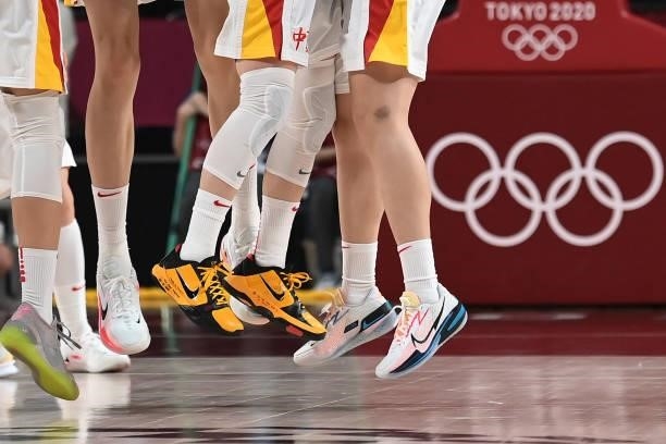 China's players jump while celebrating their win in the women's preliminary round group C basketball match between China and Australia during the...