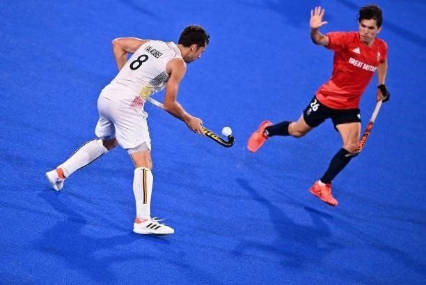 Belgium's Florent Van Aubel controls the ball as Britain's James Richard Gall gestures during their men's pool B match of the Tokyo 2020 Olympic...