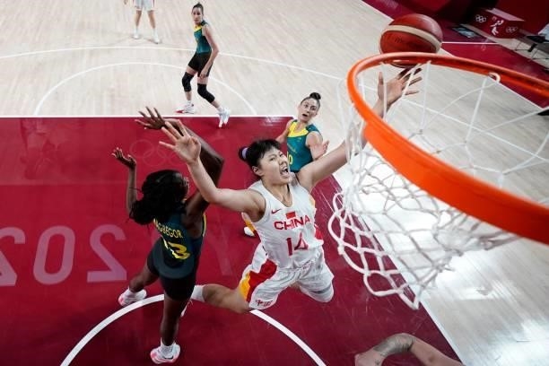 China's Li Yueru goes to the basket in the women's preliminary round group C basketball match between China and Australia during the Tokyo 2020...