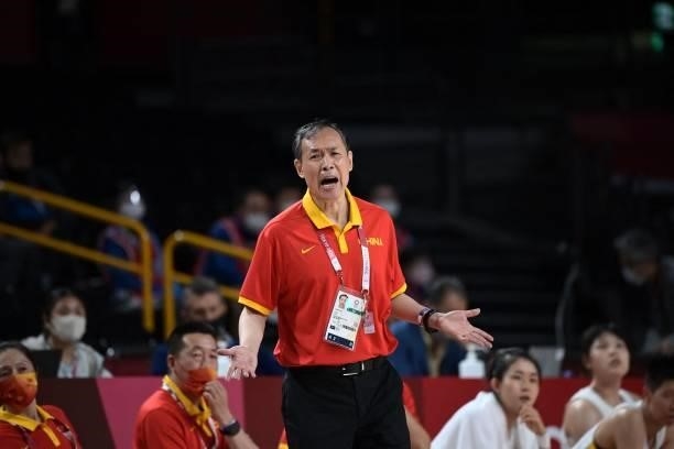 China's team coach Limin Xu gestures to his players on court in the women's preliminary round group C basketball match between China and Australia...