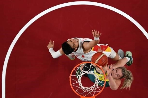 China's Huang Sijing and Australia's Liz Cambage jump for the ball in the women's preliminary round group C basketball match between China and...