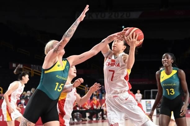 Australia's Cayla George fights for the ball with China's Shao Ting in the women's preliminary round group C basketball match between China and...