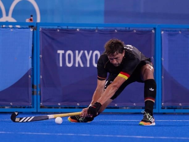 Jan Christopher Ruhr of Germany controls the ball during the Men's Pool B - Hockey Match between Germany and Netherlands on day seven of the Tokyo...