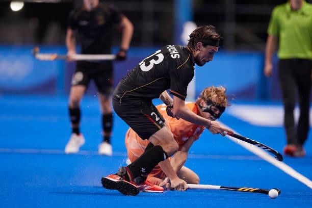 Florian Fuchs of Germany and Jip Janssen of Netherlands battle for the ball during the Men's Pool B - Hockey Match between Germany and Netherlands on...