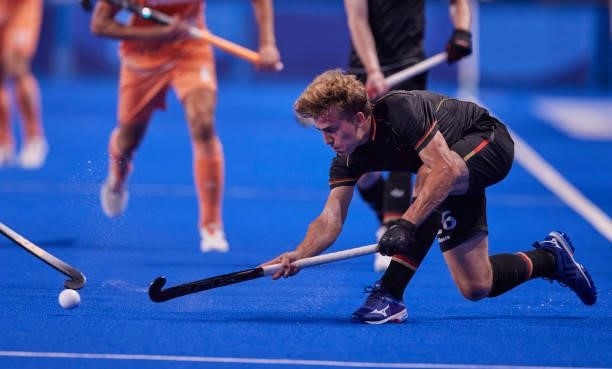 Niklas Bosserhoff of Germany controls the ball during the Men's Pool B - Hockey Match between Germany and Netherlands on day seven of the Tokyo 2020...