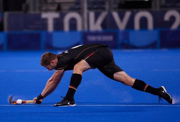 Martin Dominik Haner of Germany controls the ball during the Men's Pool B - Hockey Match between Germany and Netherlands on day seven of the Tokyo...