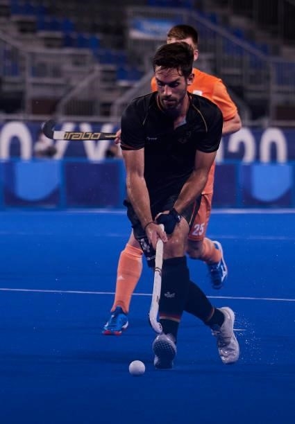 Benedikt Furk of Germany controls the ball during the Men's Pool B - Hockey Match between Germany and Netherlands on day seven of the Tokyo 2020...