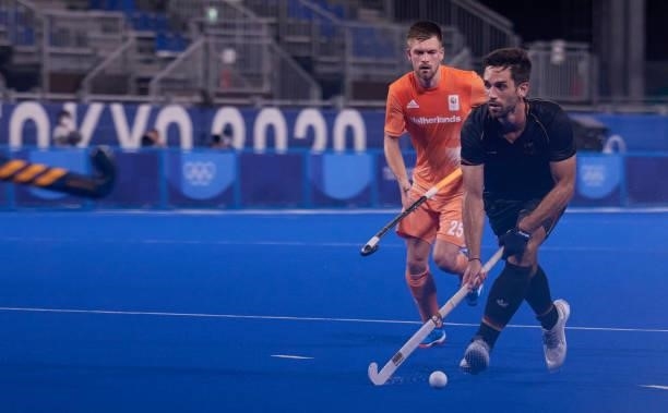 Benedikt Furk of Germany controls the ball during the Men's Pool B - Hockey Match between Germany and Netherlands on day seven of the Tokyo 2020...