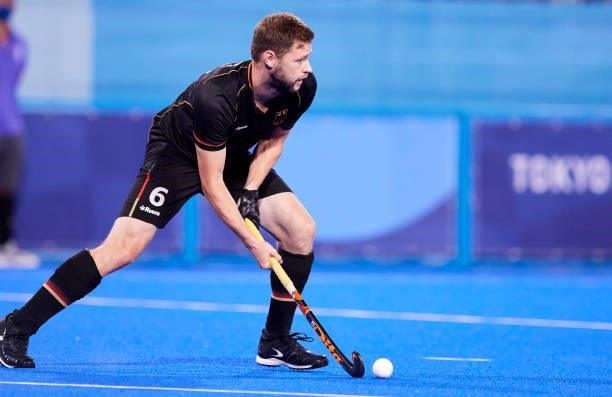 Martin Dominik Haner of Germany controls the ball during the Men's Pool B - Hockey Match between Germany and Netherlands on day seven of the Tokyo...