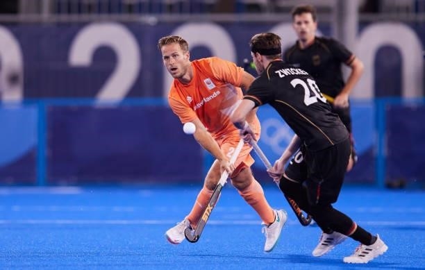 Martin Detlef Zwicker of Germany and Jeroen Hertzberger of Netherlands battle for the ball during the Men's Pool B - Hockey Match between Germany and...