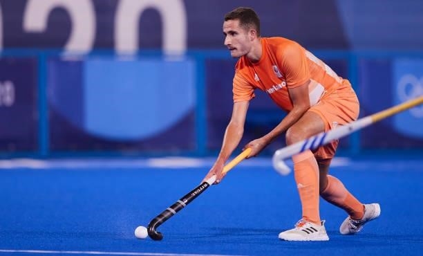 Glenn Cchuurman of Netherlands controls the ball during the Men's Pool B - Hockey Match between Germany and Netherlands on day seven of the Tokyo...