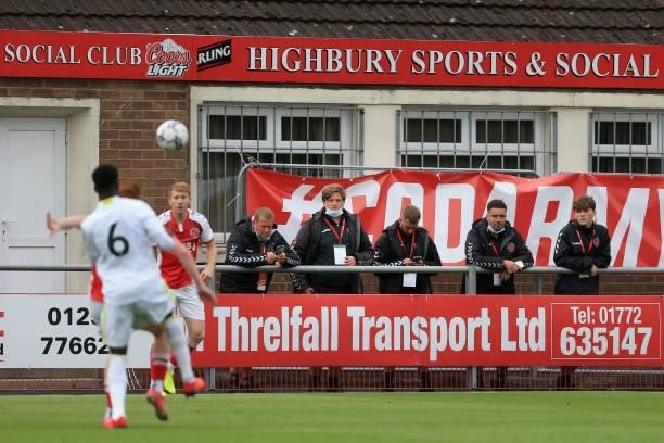 Staff members watch on from the sidelines during the Pre-Season Friendly match between Fleetwood Town and Leeds United at Highbury Stadium on July...
