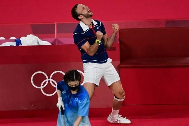 Guatemala's Kevin Cordon celebrates after beating South Korea's Heo Kwang-hee in their men's singles badminton quarter final match during the Tokyo...