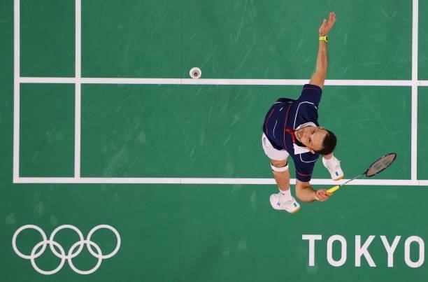 Guatemala's Kevin Cordon hits a shot to South Korea's Heo Kwang-hee in their men's singles badminton quarter final match during the Tokyo 2020...