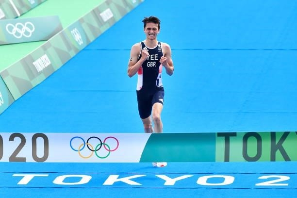 Alex YEE of Great Britain celebrates the victory as he crosses the finish line during the Triathlon Mixed Relay at Odaiba Marine Park on July 31,...