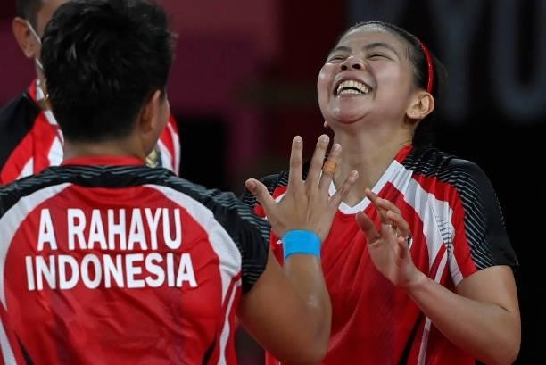 Indonesia's Greysia Polii and Indonesia's Apriyani Rahayu celebrate after winning their women's doubles badminton semi-final match against South...