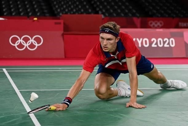 Denmark's Viktor Axelsen reaches to hit a shot to China's Shi Yuqi in their men's singles badminton quarter final match during the Tokyo 2020 Olympic...