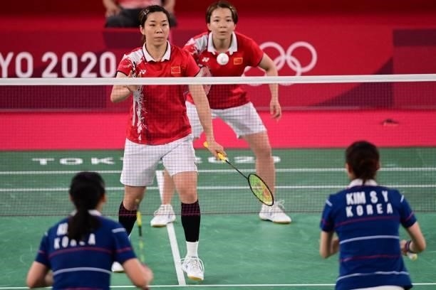 China's Chen Qingchen and China's Jia Yifan look on in their women's doubles badminton semi-final match against South Korea's Kong Hee-yong and South...