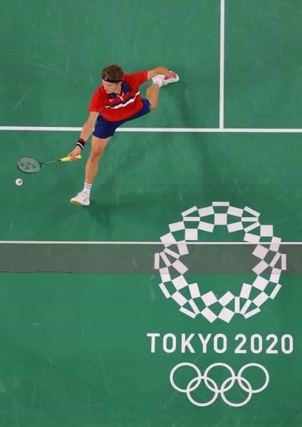 Denmark's Viktor Axelsen hits a shot to China's Shi Yuqi in their men's singles badminton quarter final match during the Tokyo 2020 Olympic Games at...