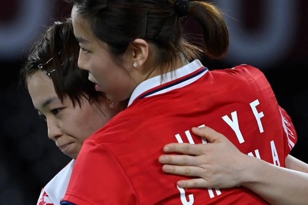 China's Chen Qingchen and China's Jia Yifan celebrate after winning their women's doubles badminton semi-final match against South Korea's Kong...