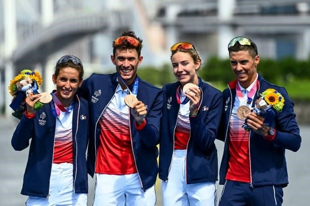 Leonie PERIAULT, Dorian CONINX, Cassandre BEAUGRAND and Vincent LUIS of France pose with their bronze medals on the podium during the Triathlon Mixed...