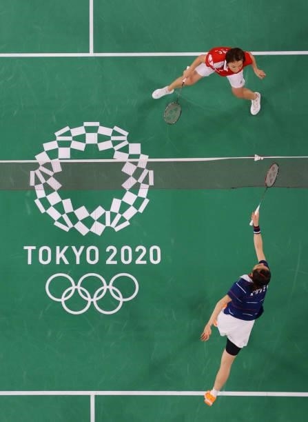 South Korea's Kim So-yeong hits a shot next to South Korea's Kong Hee-yong in their women's doubles badminton semi-final match against China's Chen...