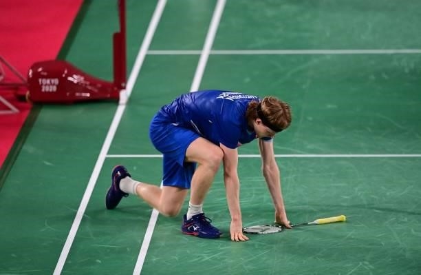 Denmark's Anders Antonsen reacts after a point with Indonesia's Anthony Sinisuka Ginting in their men's singles badminton quarter final match during...