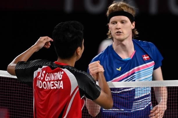 Indonesia's Anthony Sinisuka Ginting greets Denmark's Anders Antonsen after winning their men's singles badminton quarter final match during the...