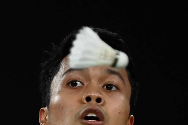 Indonesia's Anthony Sinisuka Ginting looks on as he hits a shot to Denmark's Anders Antonsen in their men's singles badminton quarter final match...