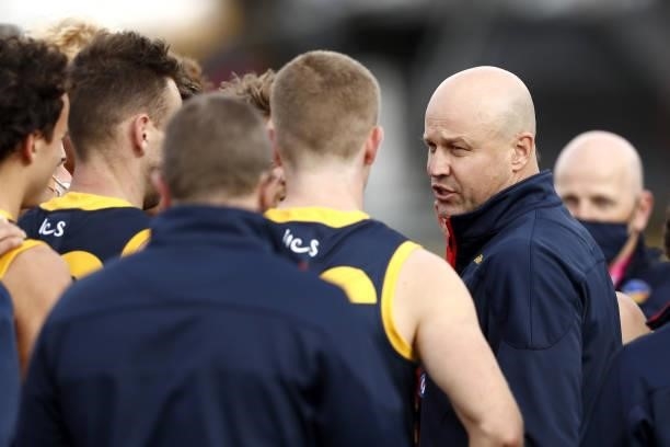 Matthew Nicks, Senior Coach of the Crows addresses his players during the 2021 AFL Round 20 match between the Western Bulldogs and the Adelaide Crows...