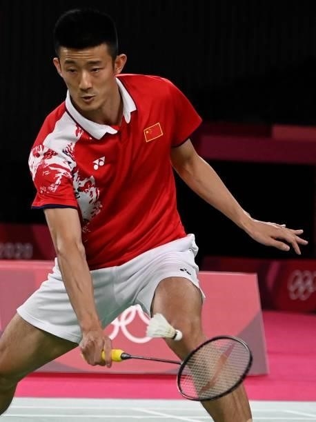 China's Chen Long hits a shot to Taiwan's Chou Tien-chen in their men's singles badminton quarter final match during the Tokyo 2020 Olympic Games at...