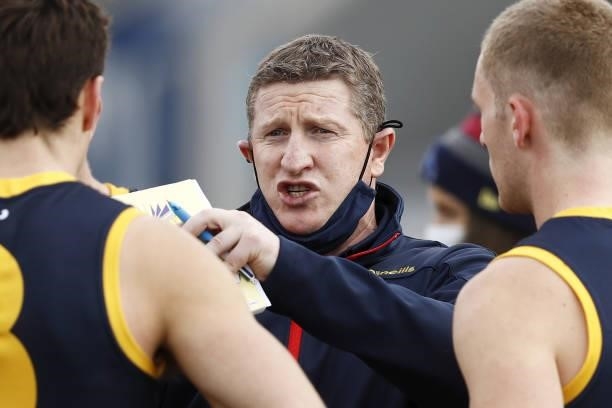 Scott Burns, Senior Assistant Coach of the Crows addresses his players during the 2021 AFL Round 20 match between the Western Bulldogs and the...
