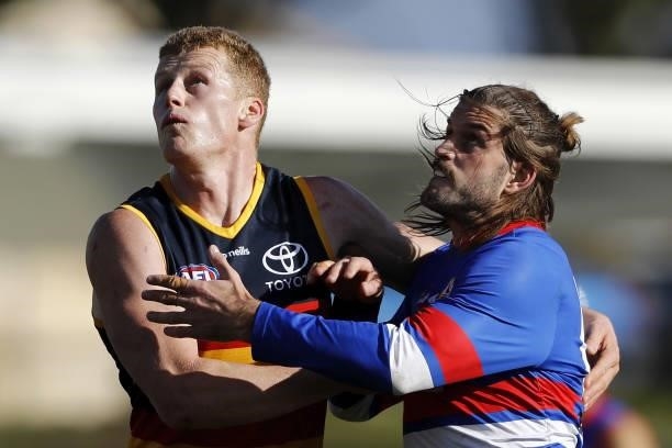 Reilly OBrien of the Crows and Josh Bruce of the Bulldogs compete for the ball during the 2021 AFL Round 20 match between the Western Bulldogs and...