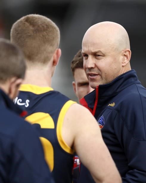 Matthew Nicks, Senior Coach of the Crows addresses his players during the 2021 AFL Round 20 match between the Western Bulldogs and the Adelaide Crows...