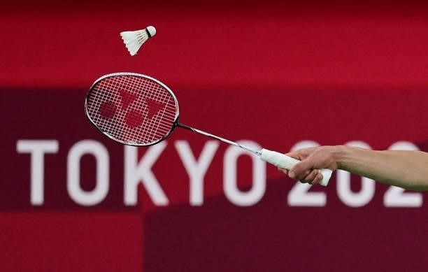 Taiwan's Chou Tien-chen hits a shot to China's Chen Long in their men's singles badminton quarter final match during the Tokyo 2020 Olympic Games at...