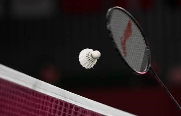 China's Chen Long hits a shot to Taiwan's Chou Tien-chen in their men's singles badminton quarter final match during the Tokyo 2020 Olympic Games at...